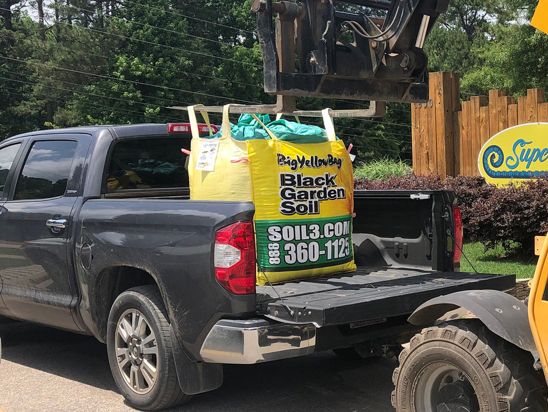 pick up a BigYellowBag of compost in a pickup truck or trailer